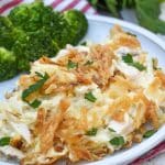 french onion chicken casserole served on a white plate with steamed broccoli on the side