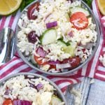 greek rice salad in two small gray bowls