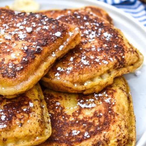 a pile of uncrushable french toast on a white plate