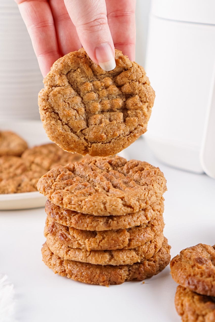 a stack of air fried almond butter cookies on white countertop