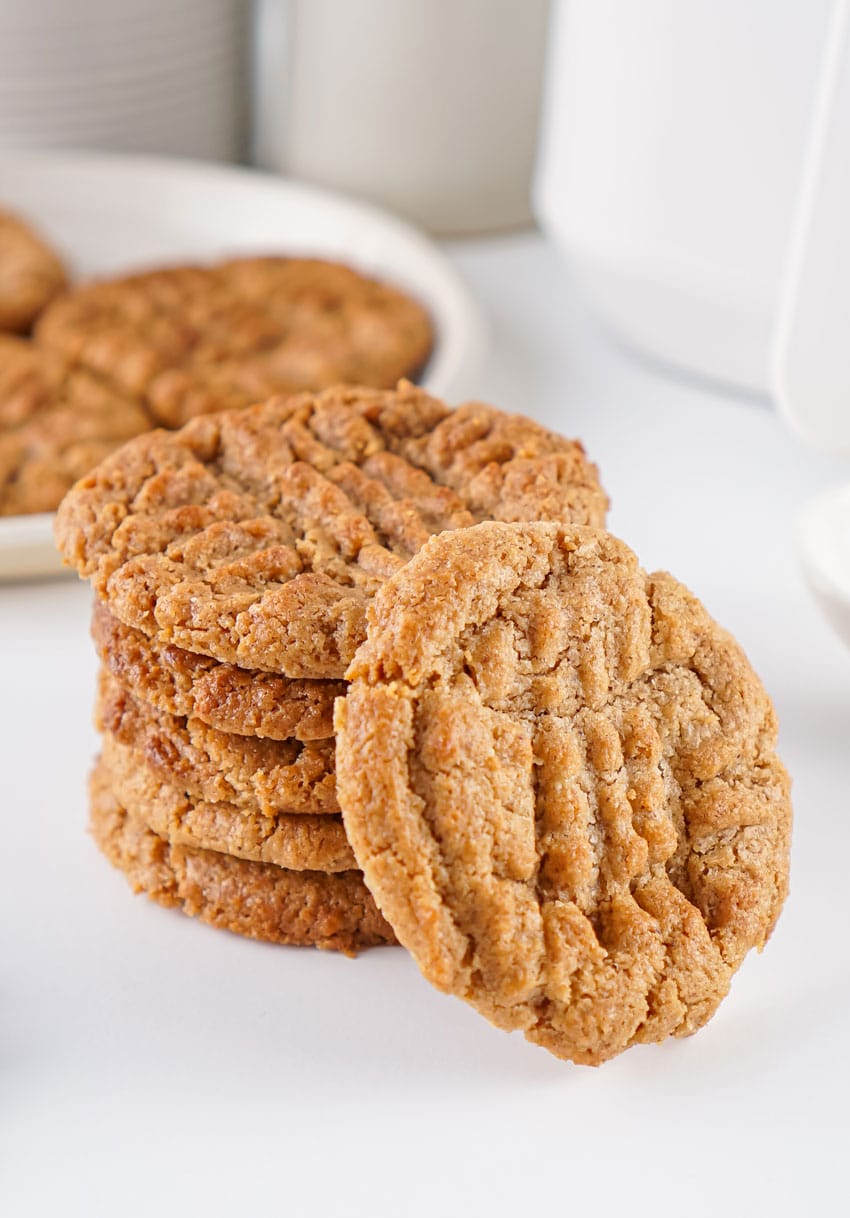 a stack of air fried almond butter cookies on white countertop