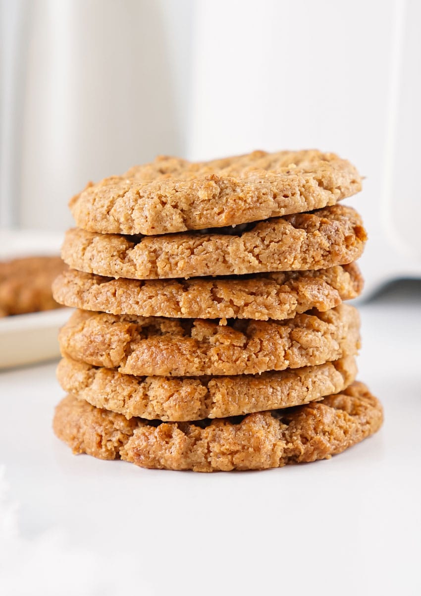 a stack of air fried almond butter cookies on white countertop
