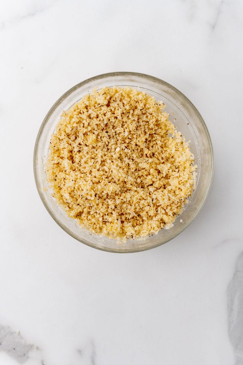 seasoned bread crumbs in a glass mixing bowl