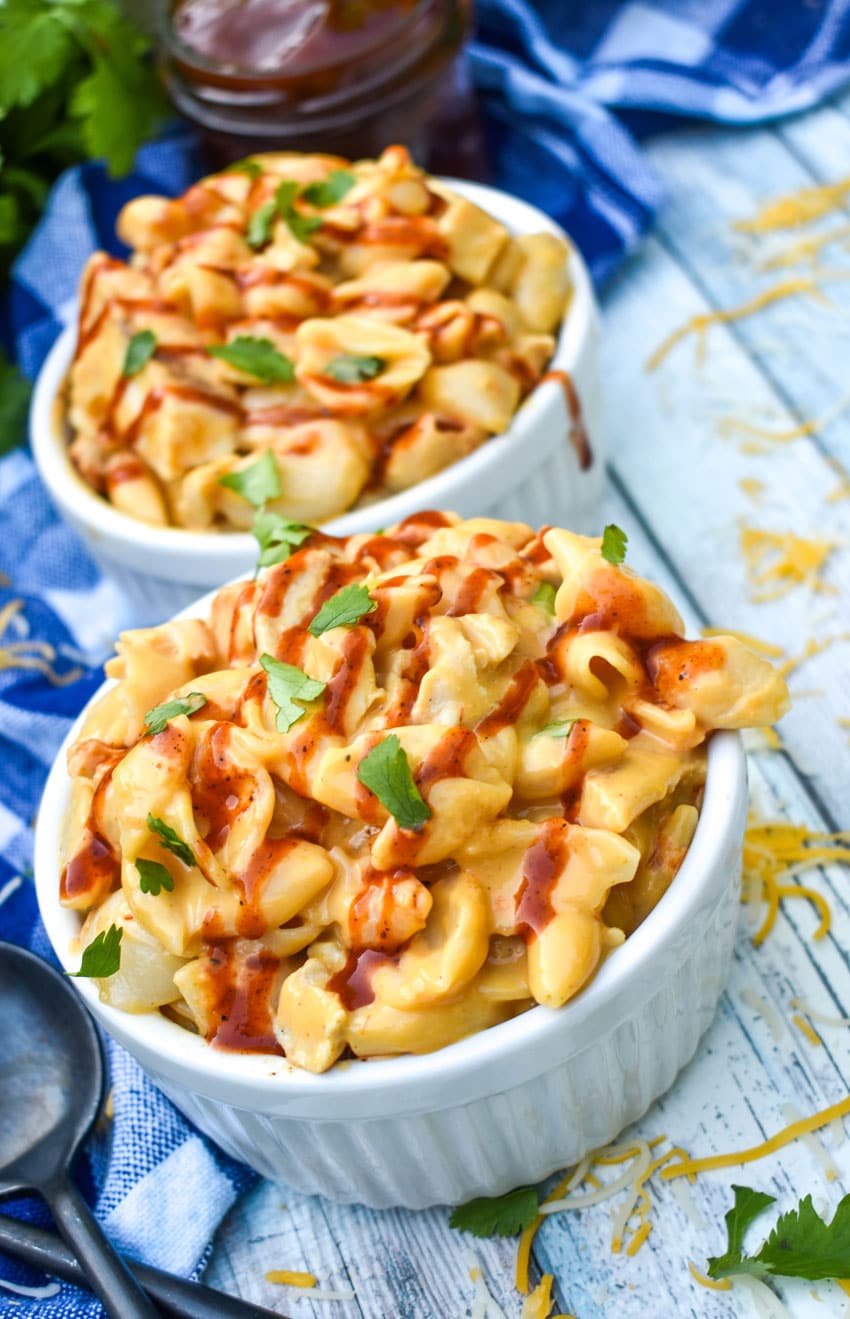 barbecue chicken mac and cheese in two small white ramekins