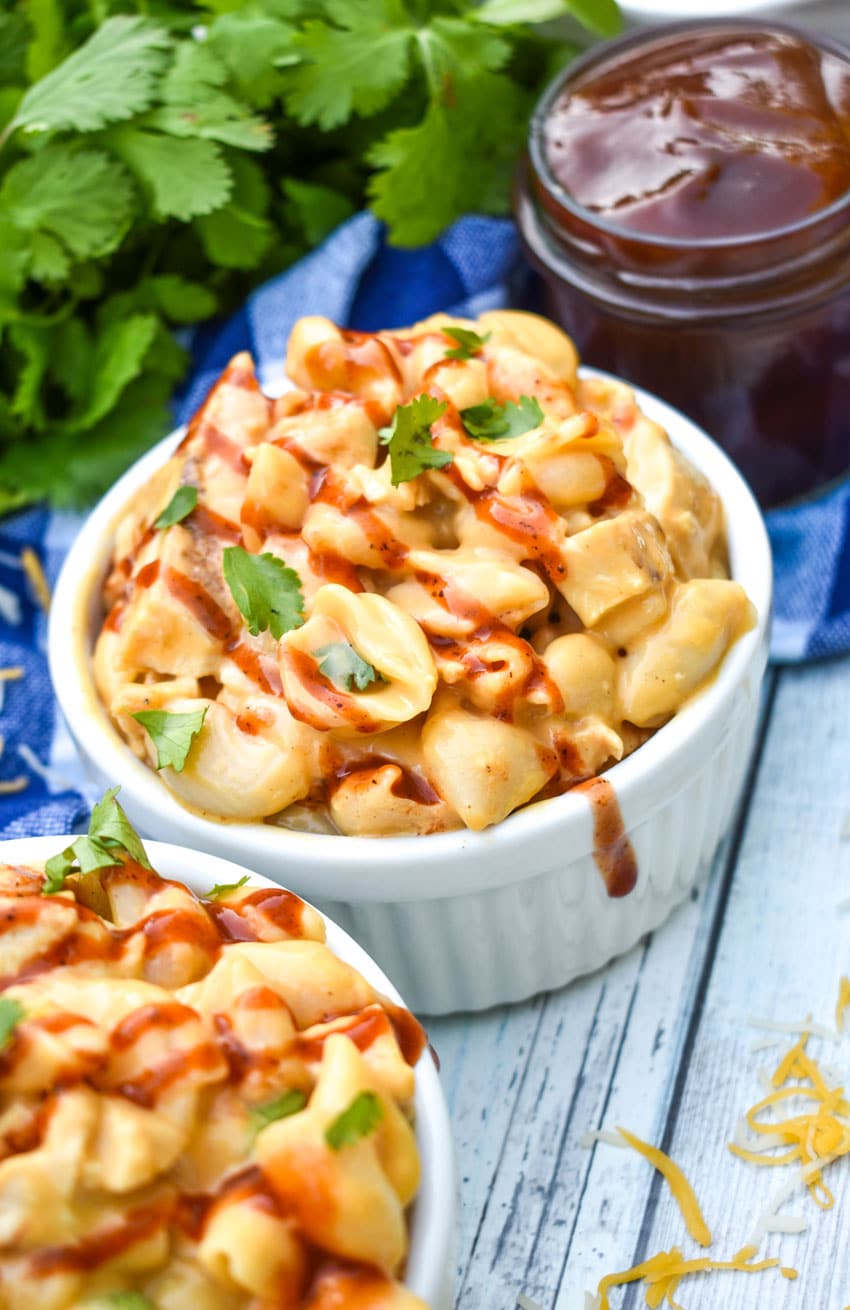 barbecue chicken mac and cheese in two small white ramekins
