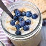 blueberry cheesecake overnight oats in two small glass jars