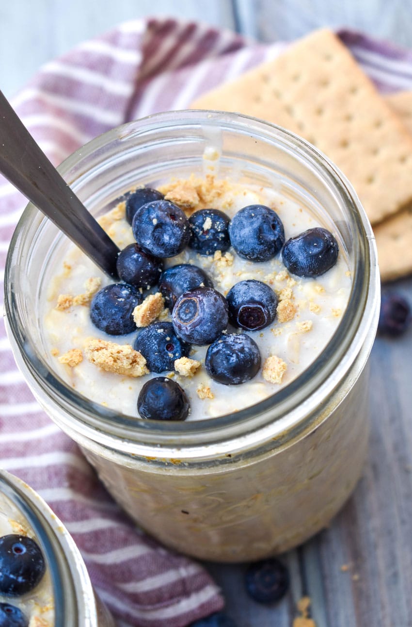 blueberry cheesecake overnight oats in two small glass jars