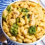cheesy chicken and broccoli macaroni and cheese in a white bowl