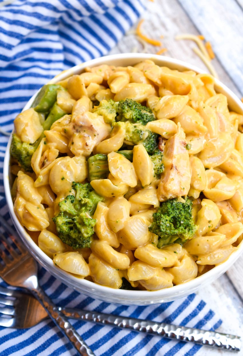cheesy chicken and broccoli macaroni and cheese in a white bowl