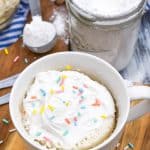 a microwave mug cupcake on a wooden cutting board