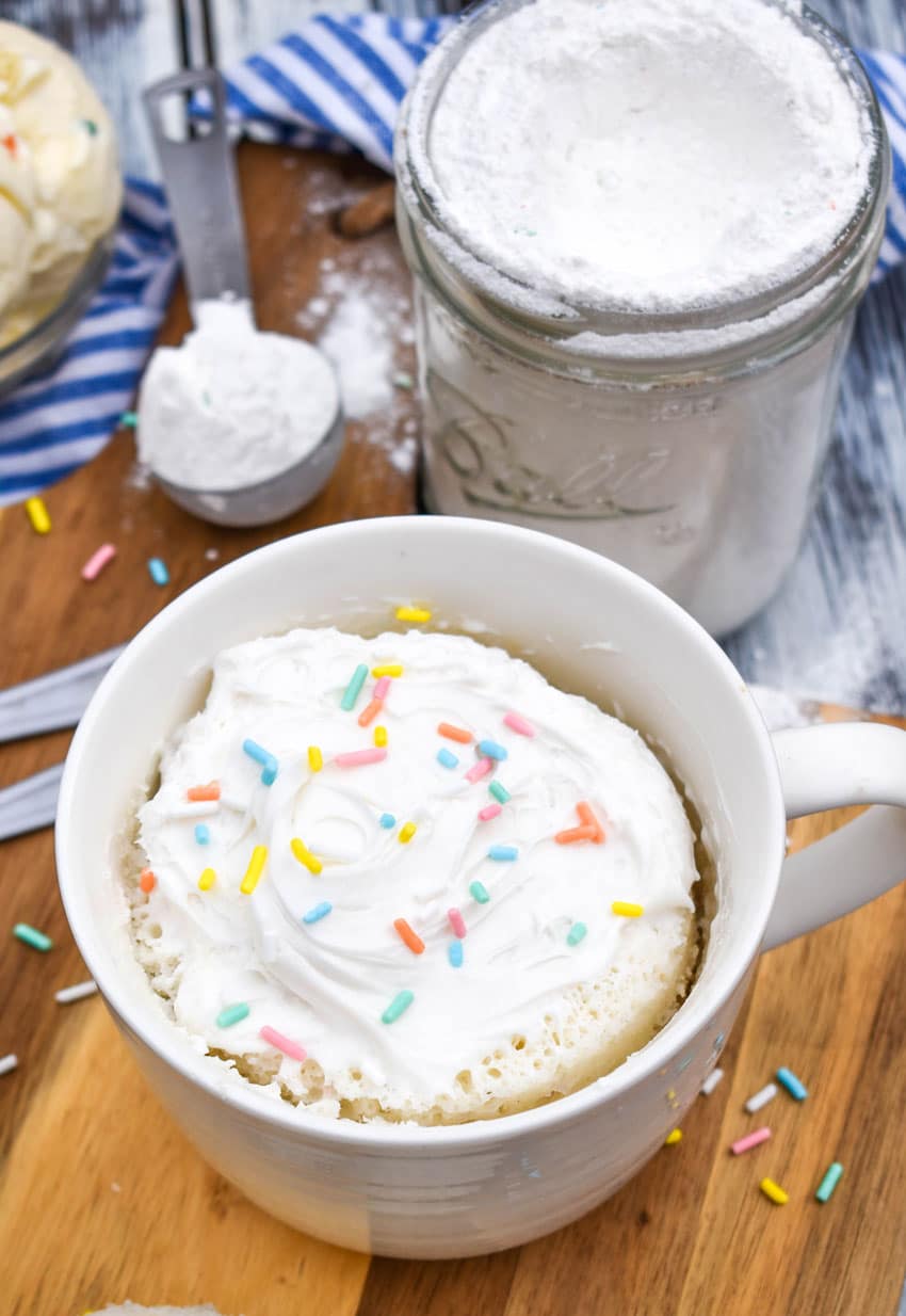 a microwave mug cupcake on a wooden cutting board
