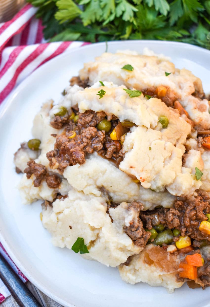 slow cooker shepherds pie served on a white dinner plate