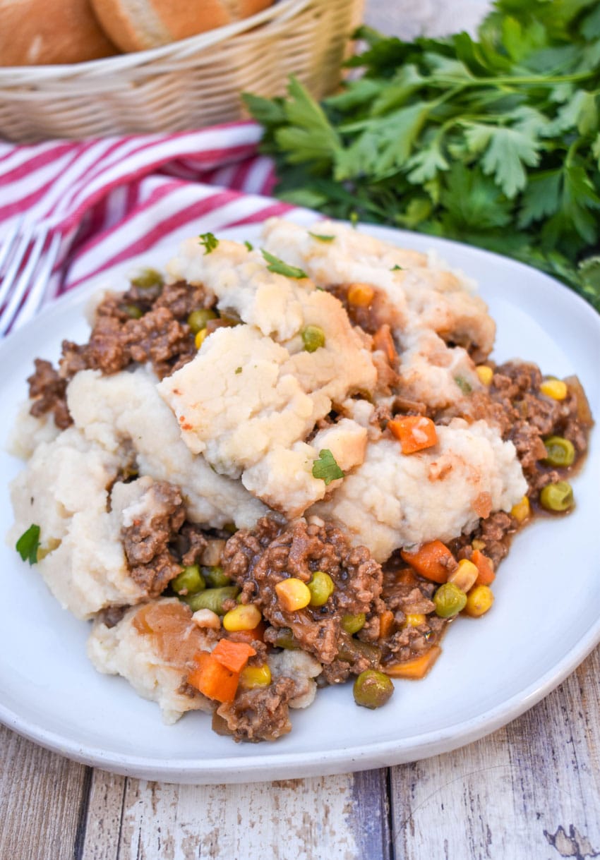 slow cooker shepherds pie served on a white dinner plate