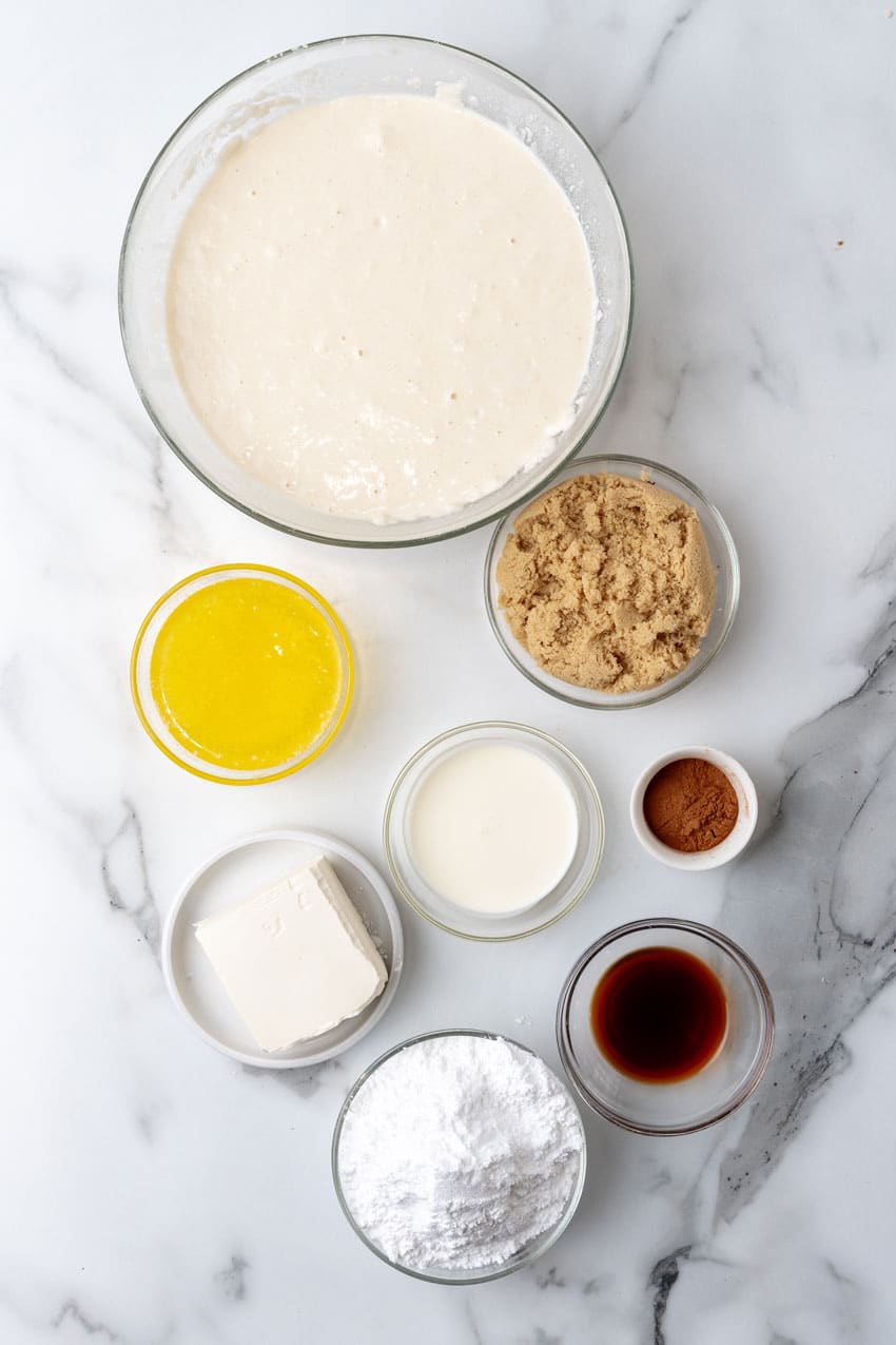 an overhead image showing the measured ingredients needed to make a batch of cinnamon roll pancakes