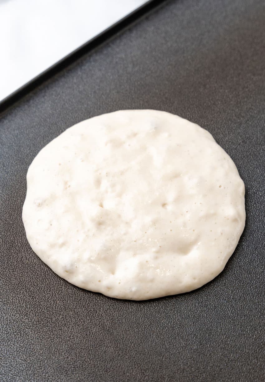 pancake batter on a hot griddle