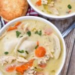 chicken and pierogi stew in two small white soup bowls