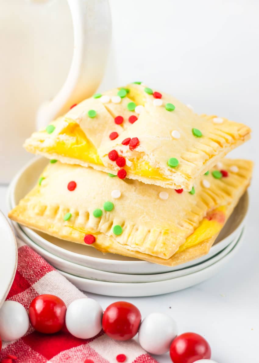 two homemade mcdonald's holiday pies stacked on a small white plate