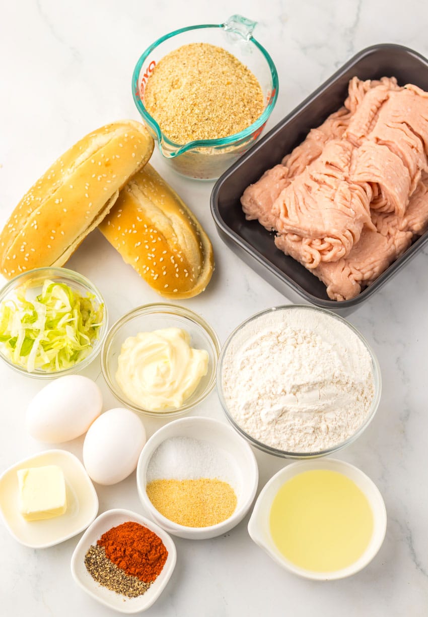 an overhead image showing the measured ingredients needed to make a copycat burger king original chicken sandwich