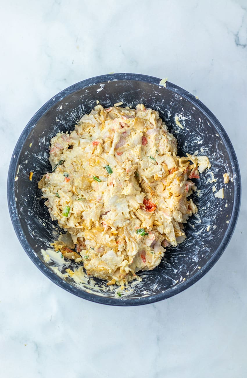 crab rangoon filling in a black mixing bowl