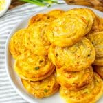 crab rangoon pinwheels stacked on a white plate