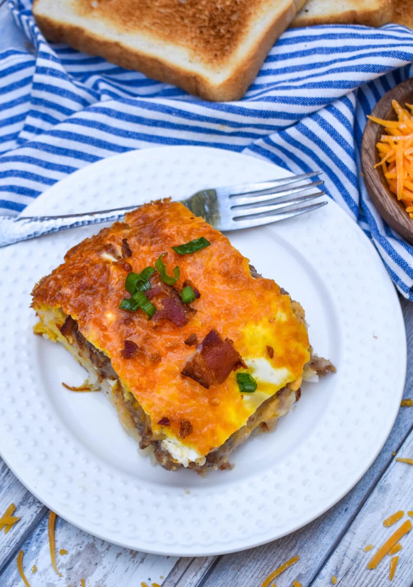 a slice of loaded hashbrown casserole on a small white plate