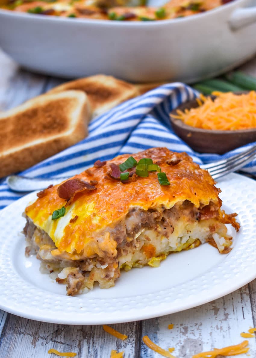 a slice of loaded hashbrown casserole on a small white plate