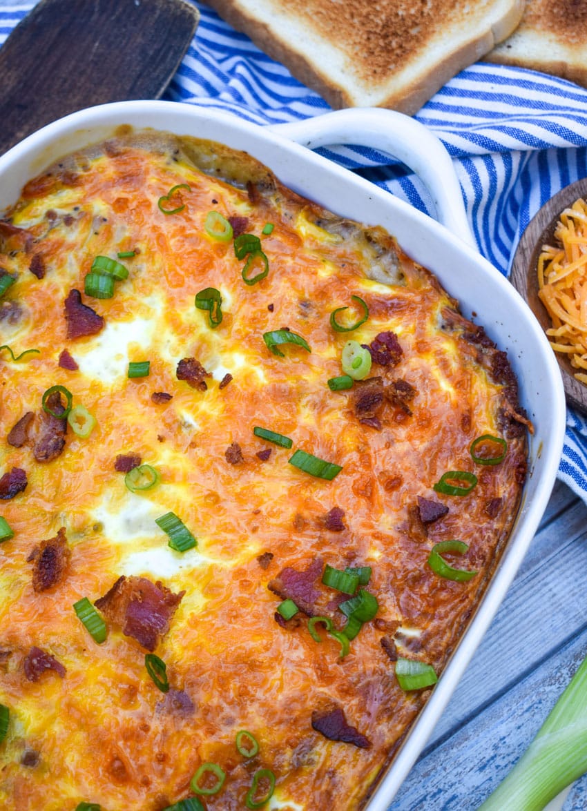 loaded hashbrown casserole in a white baking dish
