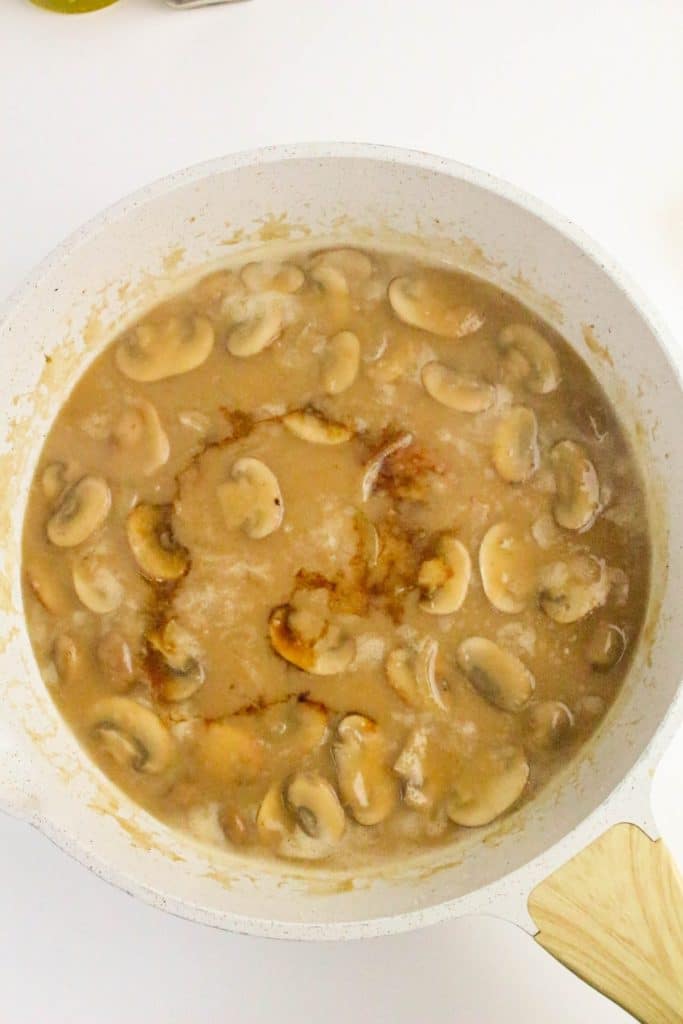 mushroom gravy in a white skillet