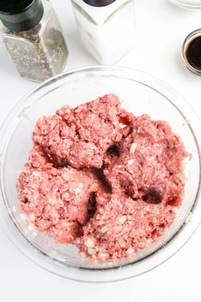 ground beef mixture in a glass mixing bowl