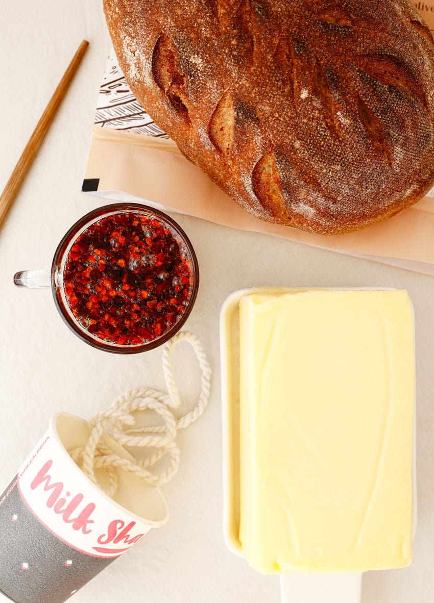 an overhead image showing the measured ingredients needed to make tiktok's viral hot honey butter candle