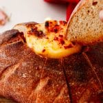 a lit hot honey butter candle in a hollowed out bread bowl