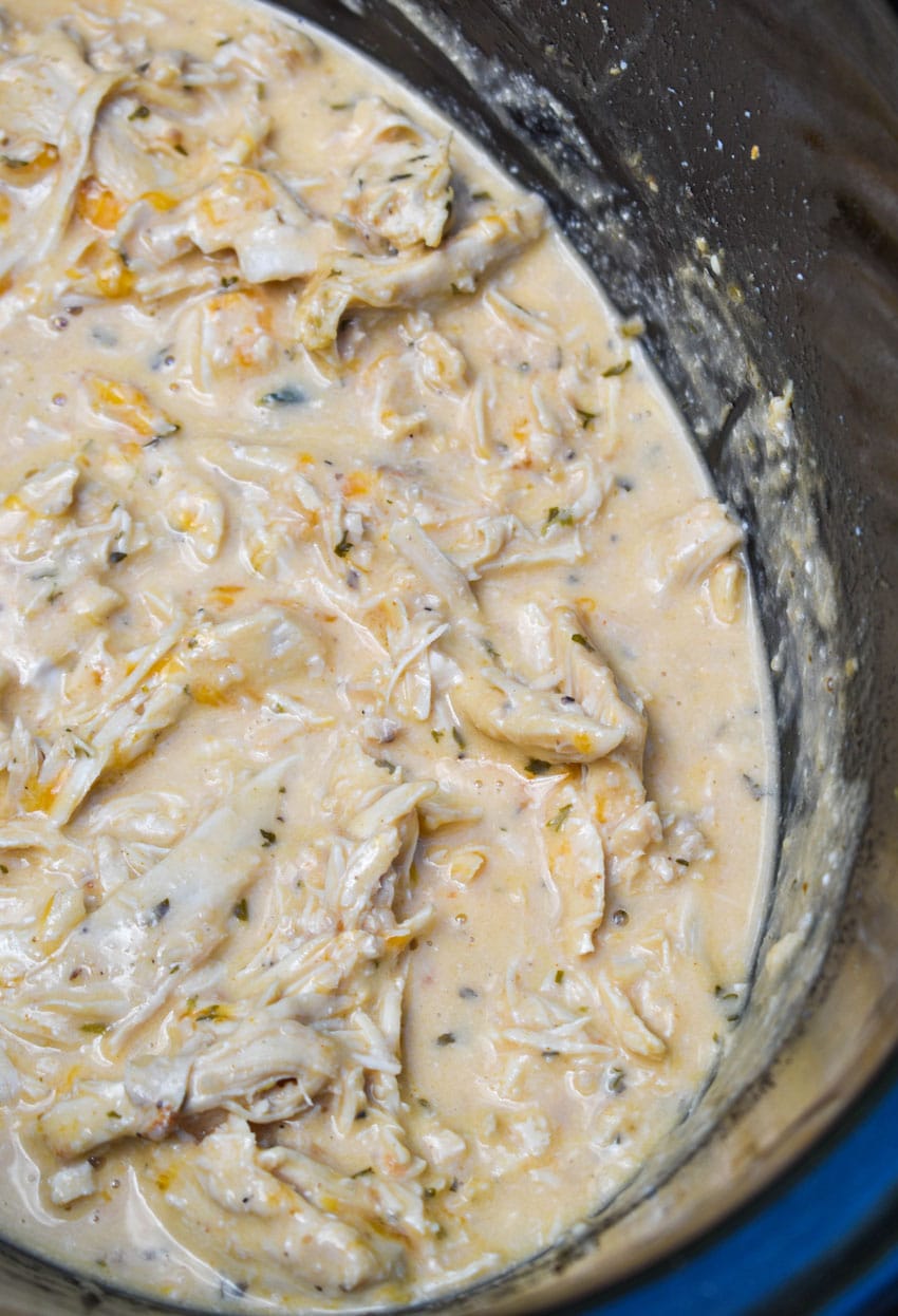 slow cooker garlic parmesan chicken in the black bowl of a crockpot