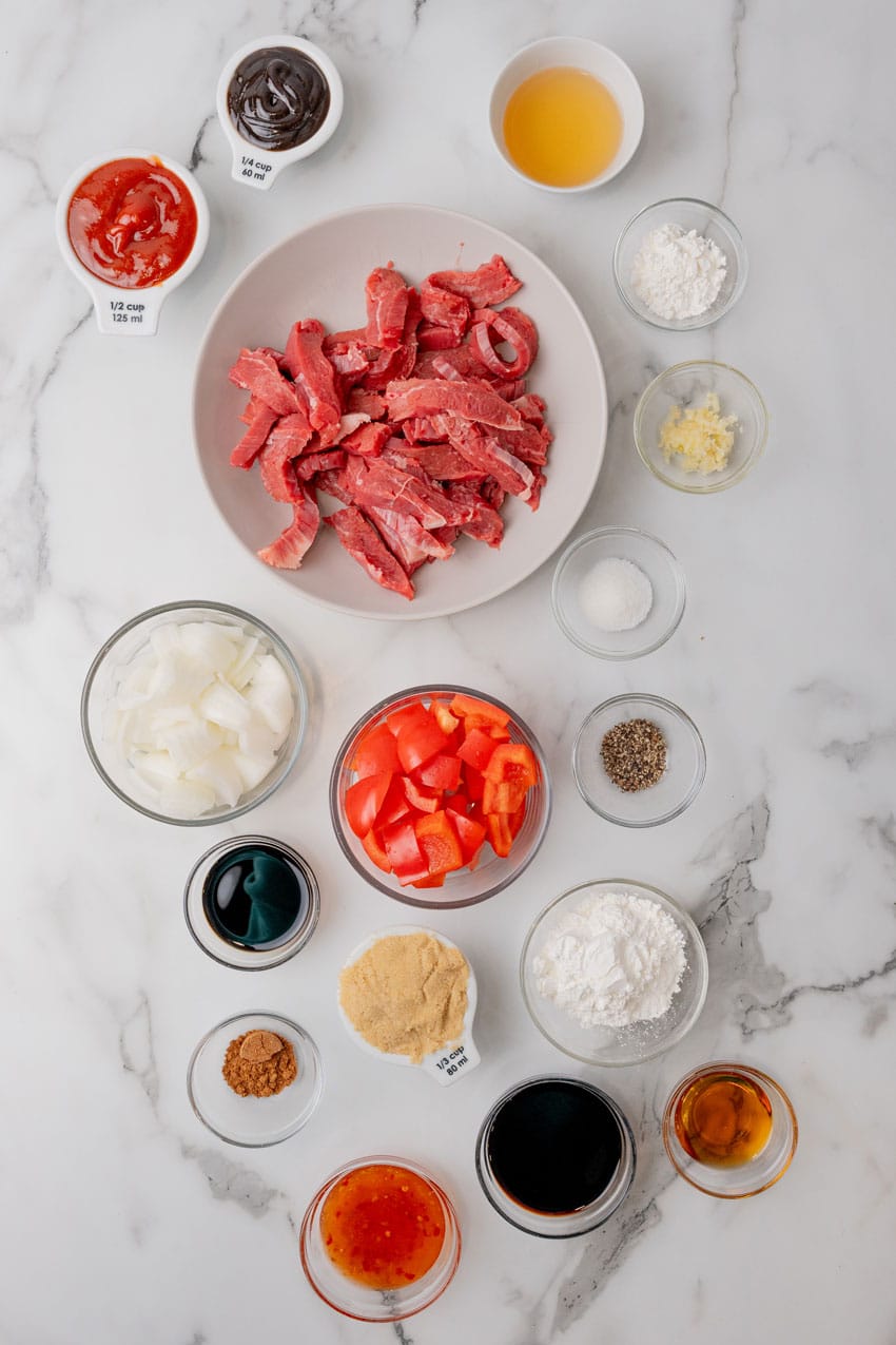 an overhead image showing the measured ingredients needed to make beijing beef at home