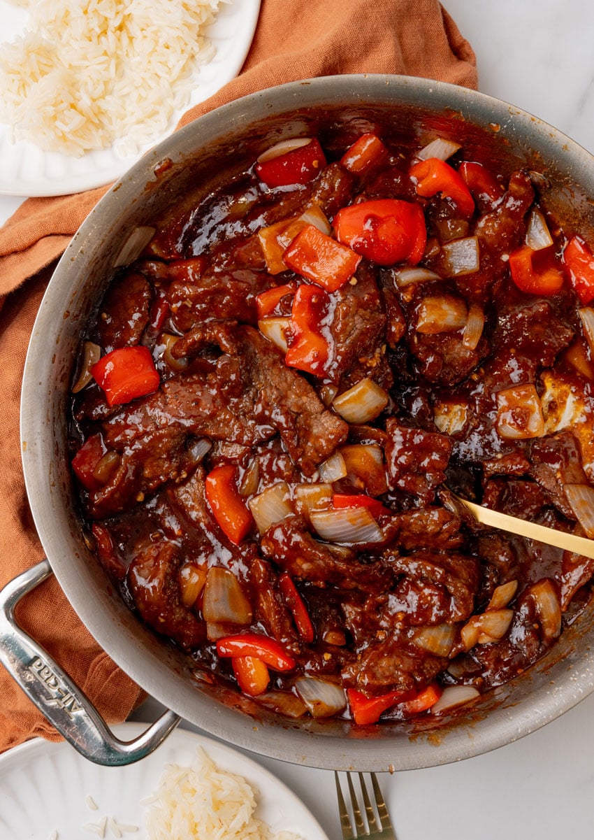 homemade beijing beef in a large metal skillet