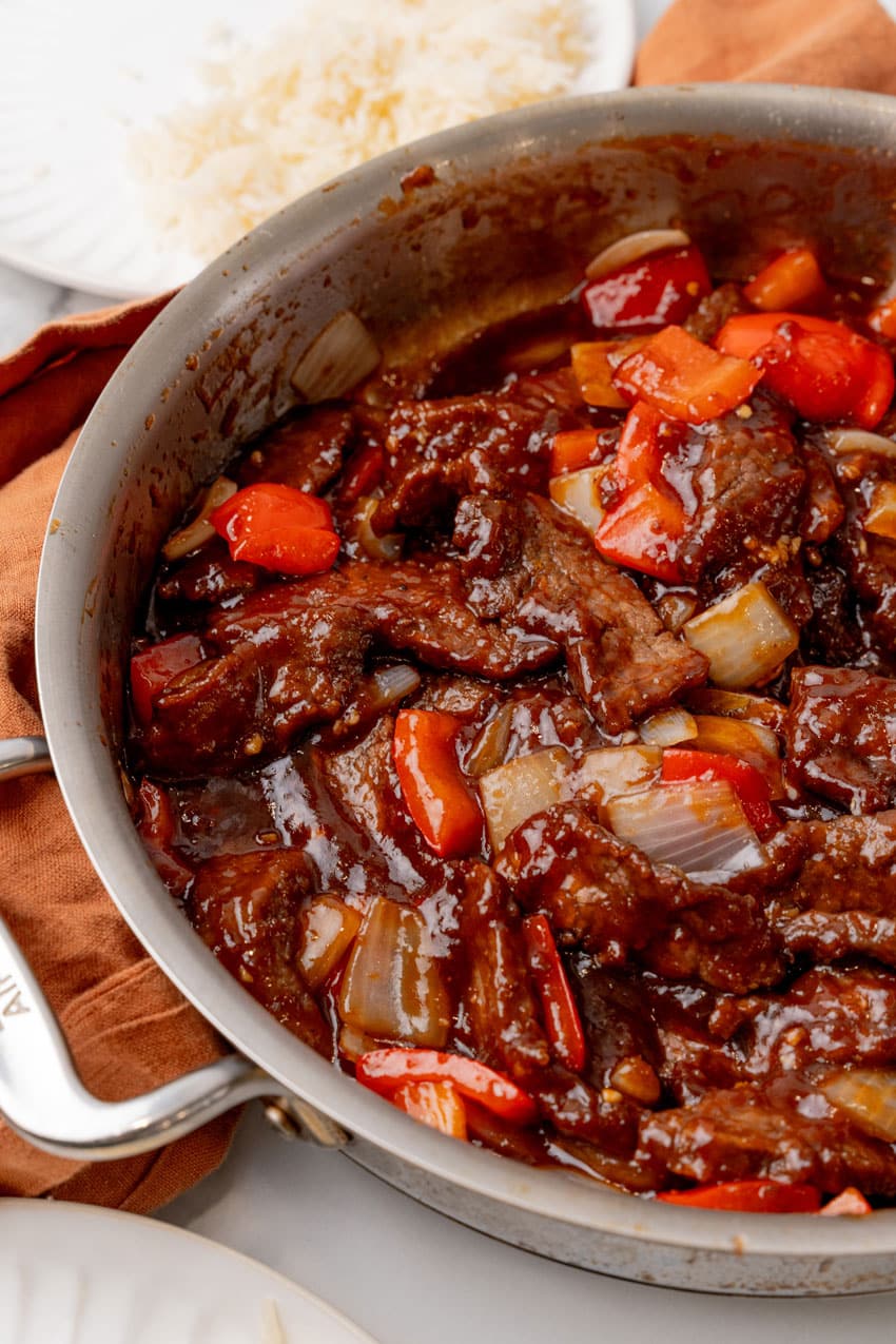 homemade beijing beef in a large metal skillet
