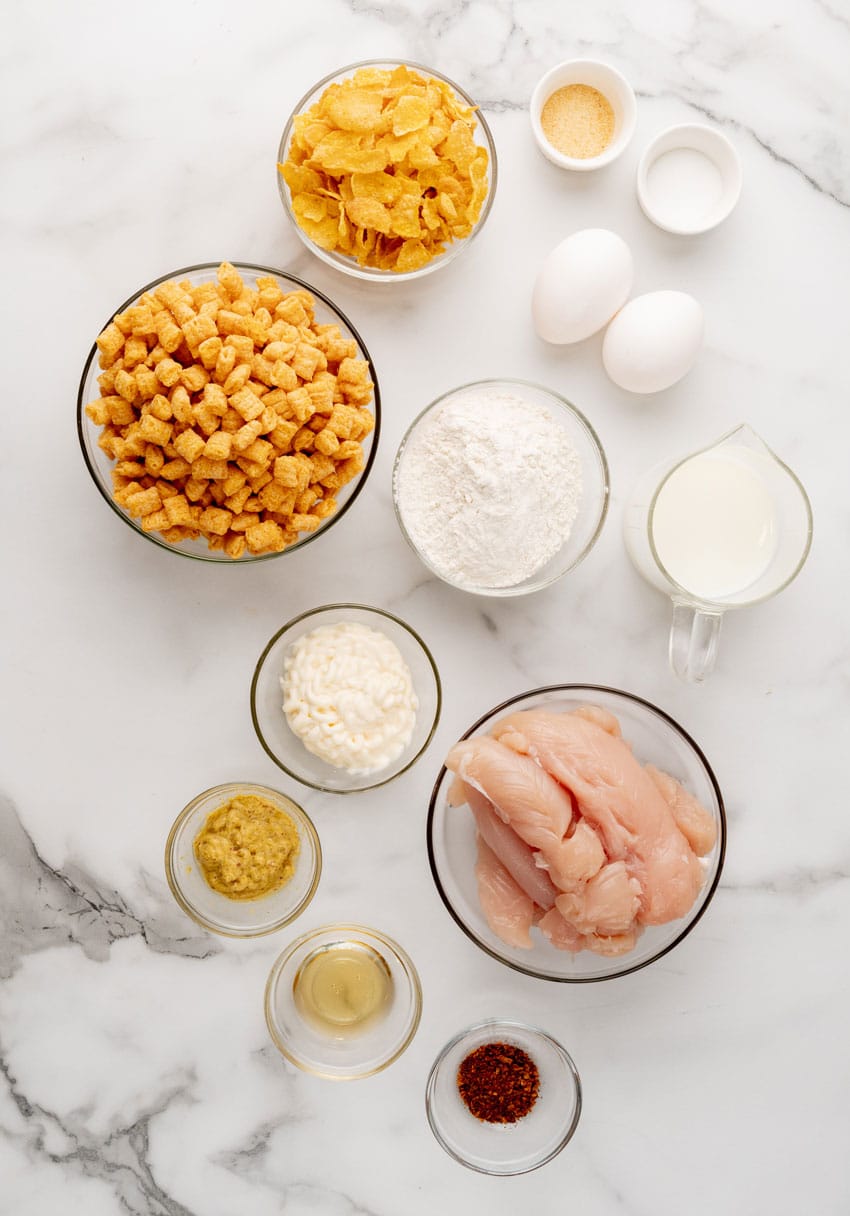 an overhead image showing the measured ingredients needed to make a batch of planet hollywood's captain crunch chicken tenders
