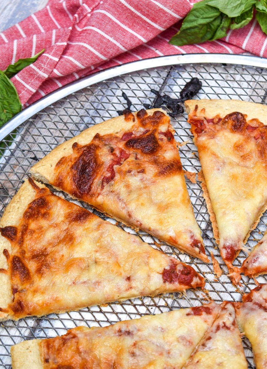 slices of cheese pizza made with 5 minute pizza sauce on a metal pizza pan