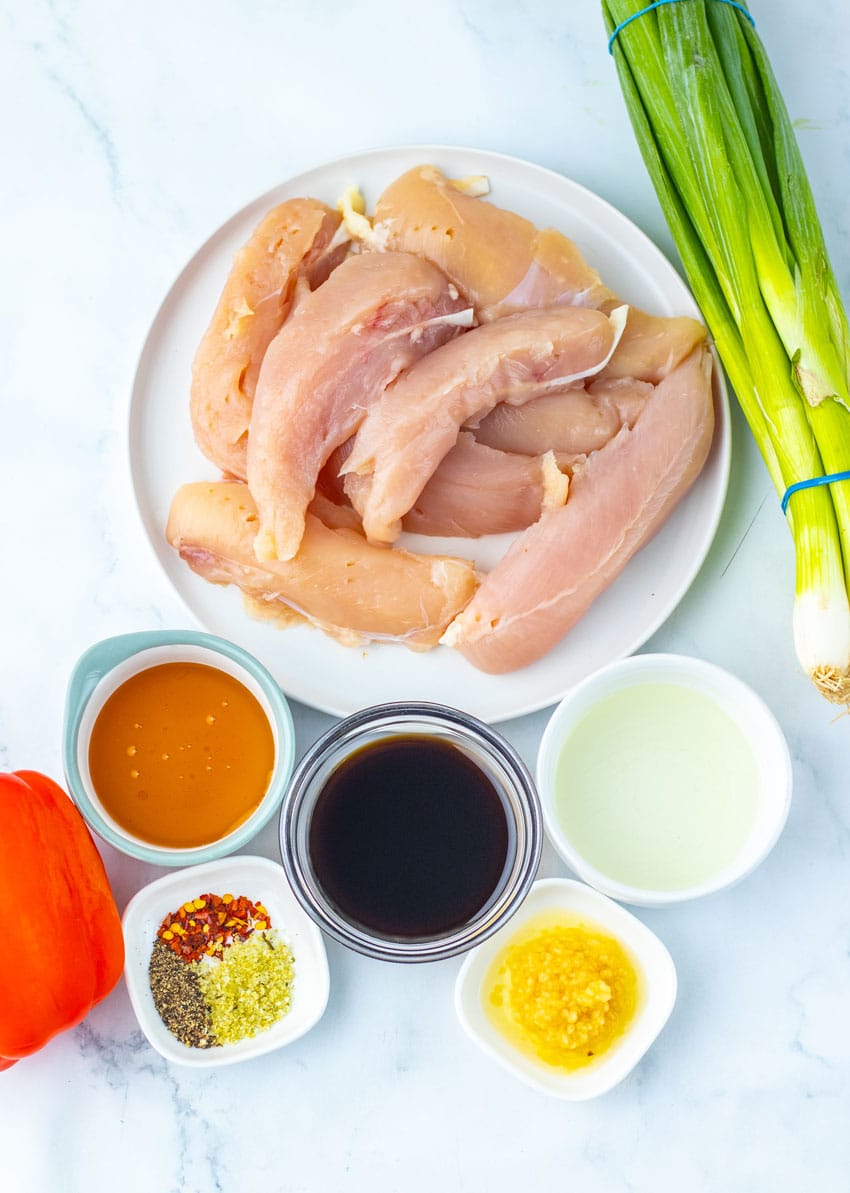 AN OVERHEAD IMAGE SHOWING THE MEASURED INGREDIENTS NEEDED TO MAKE A BATCH OF HONEY PEPPER CHICKEN