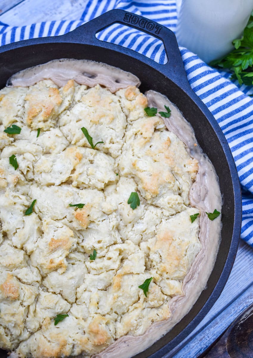 sausage biscuit and gravy baked in a cast iron skillet