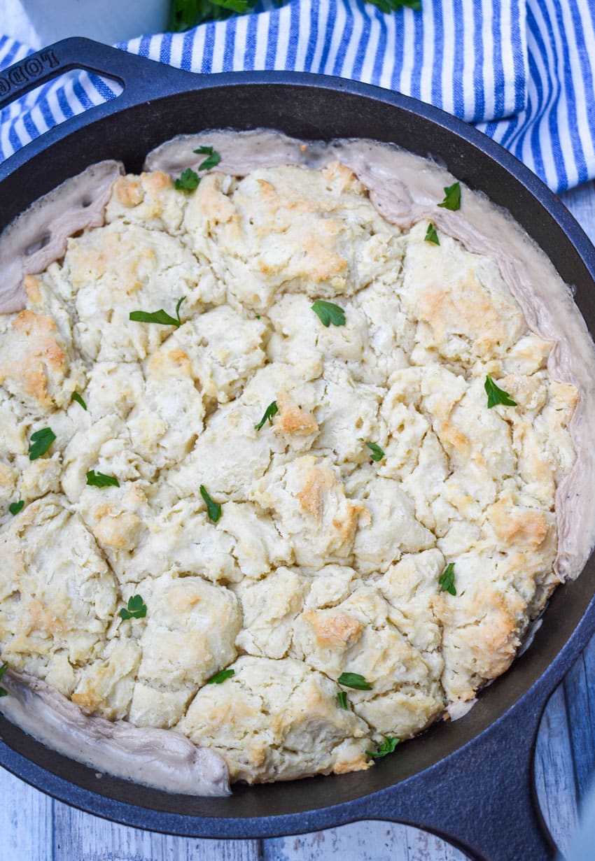 sausage biscuit and gravy baked in a cast iron skillet