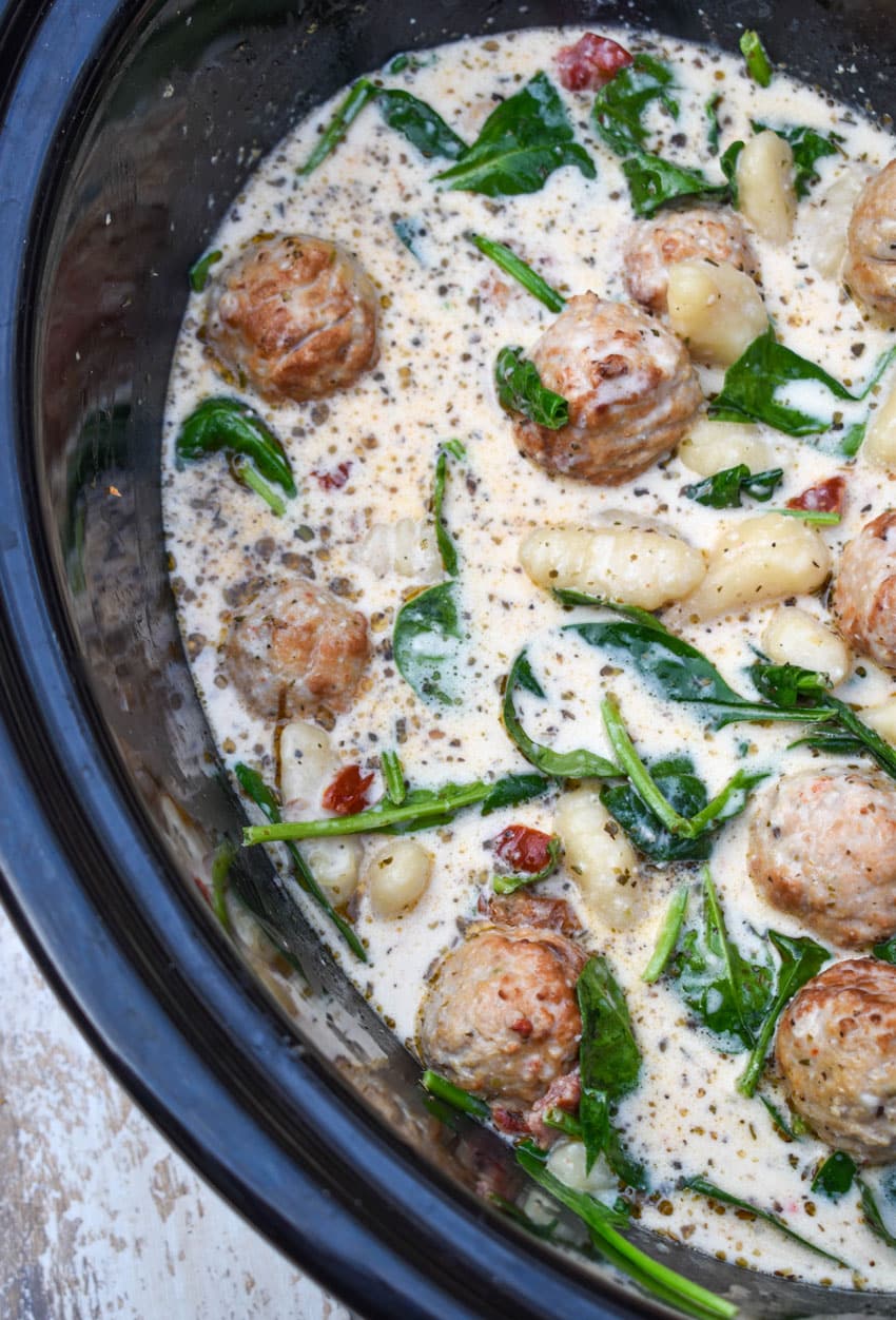 marry me meatballs with gnocchi in the black bowl of a slow cooker