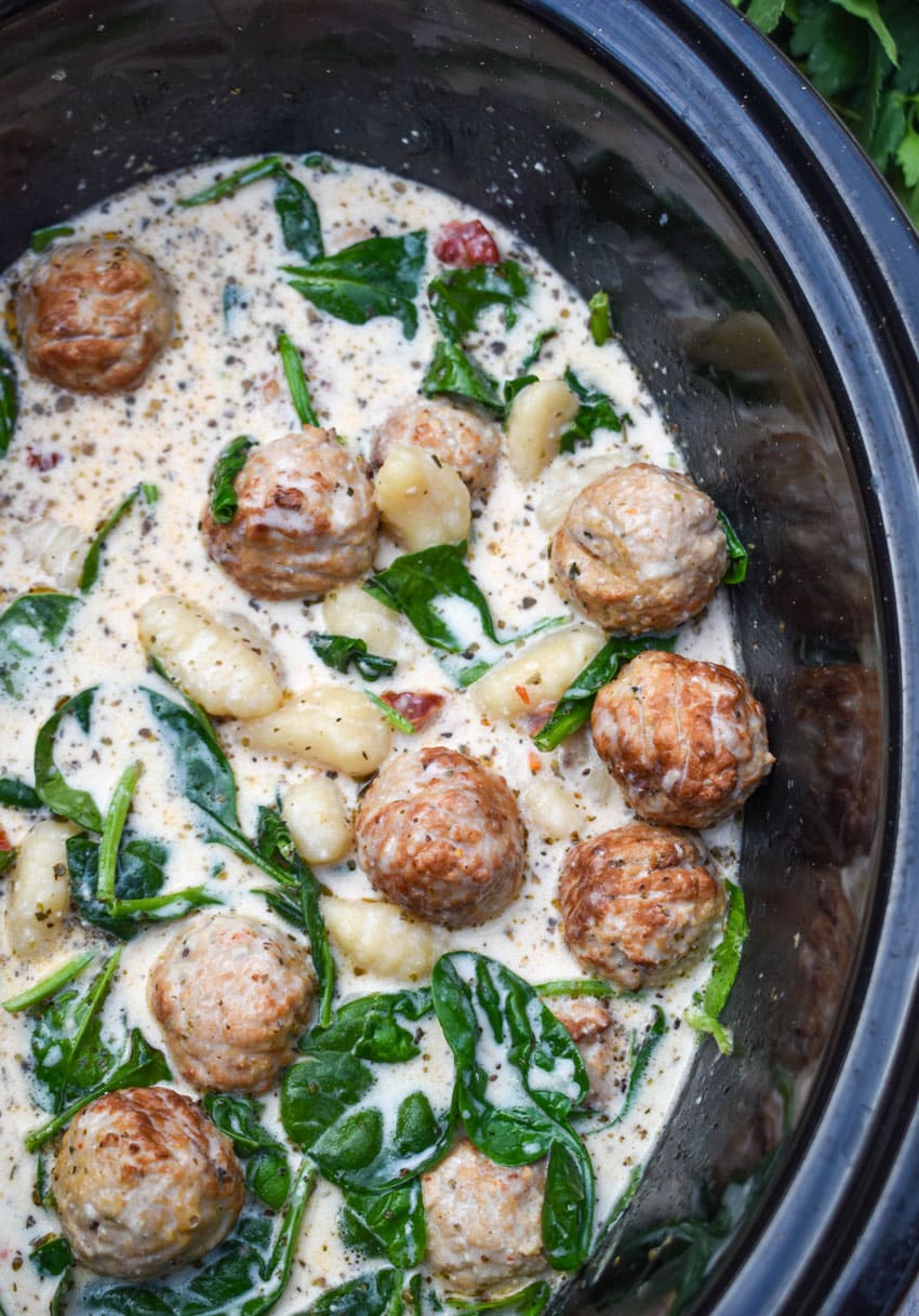 marry me meatballs with gnocchi in the black bowl of a slow cooker