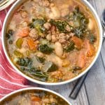 tuscan white bean soup with kale in two white bowls
