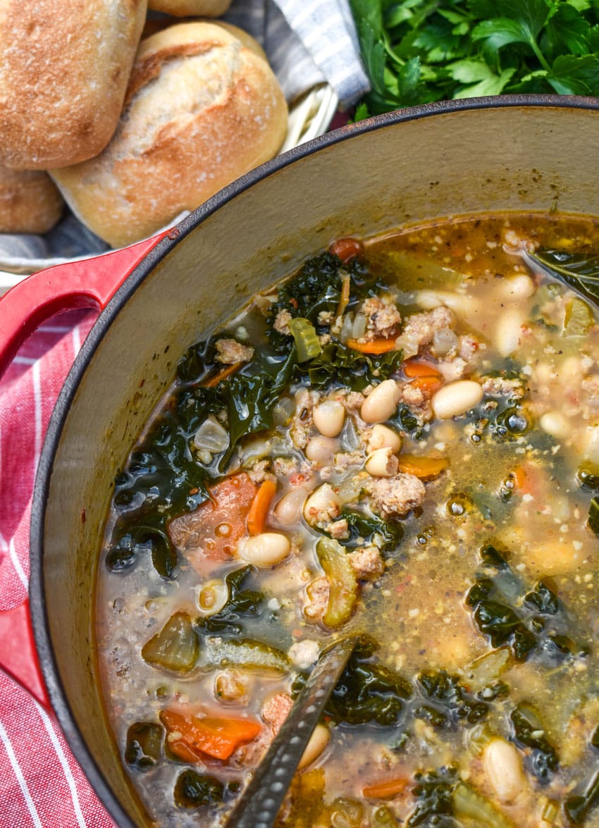 tuscan white bean soup with kale in a large red dutch oven