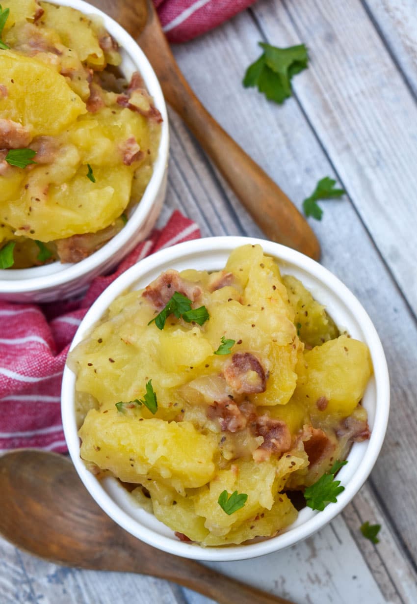 homemade german potato salad in two small white bowls