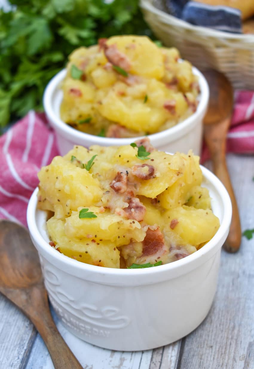 homemade german potato salad in two small white bowls