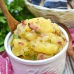 warm german potato salad in a small white bowl