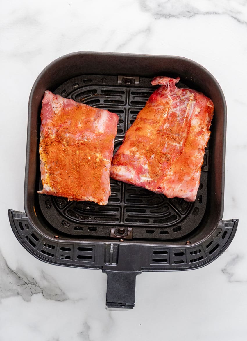 ribs in the basket of an air fryer
