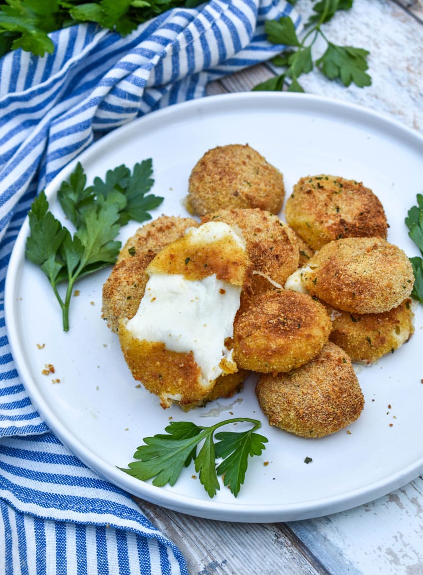 air fried babybell cheese in a pile on a white plate