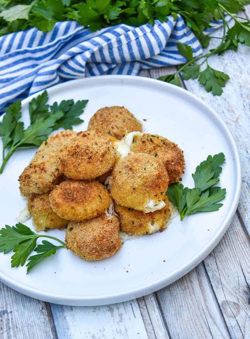 air fried babybell cheese in a pile on a white plate